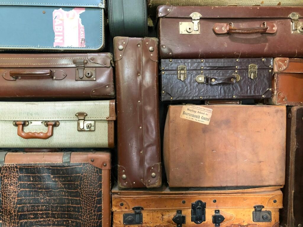 Assorted vintage leather luggage and suitcases