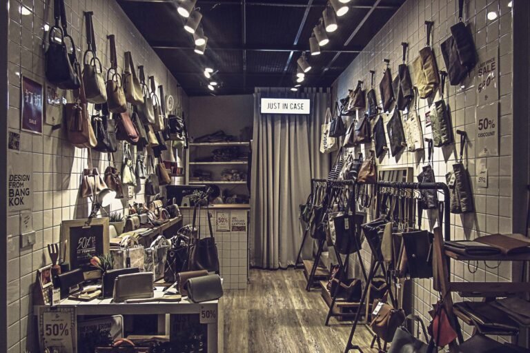Stylish boutique store interior featuring an elegant collection of luxury bags displayed on tiled walls