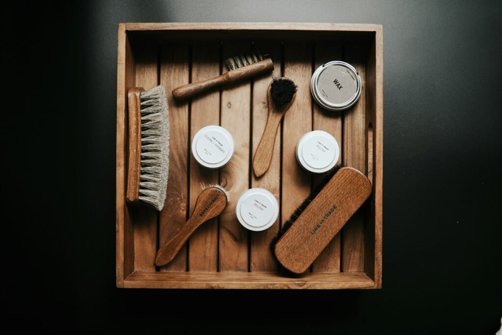 Collection of brown and grey cleaning brushes