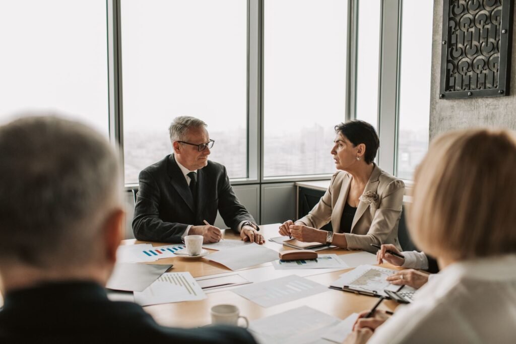 Business professionals engaged in a strategic meeting in a modern boardroom
