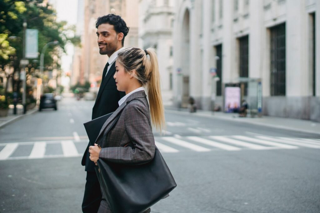 Business professionals walking confidently in a city street