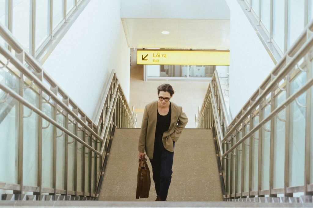Businesswoman with a briefcase climbing airport stairs