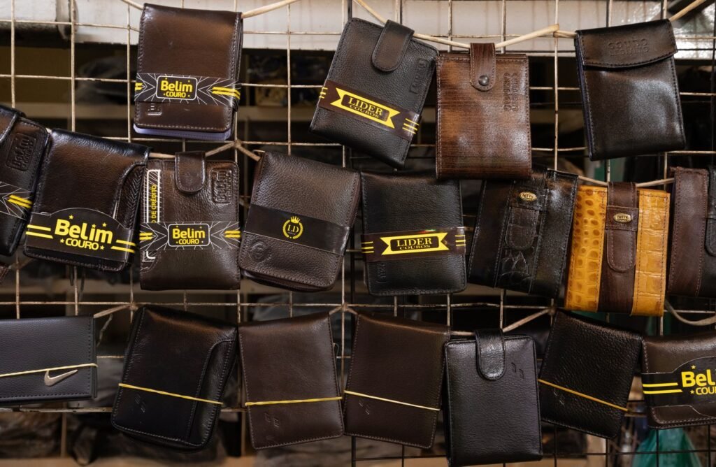 Collection of leather wallets on a market rack, showcasing different styles