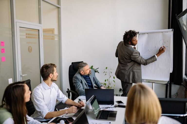 A diverse team in a modern office engaged in a strategic business meeting