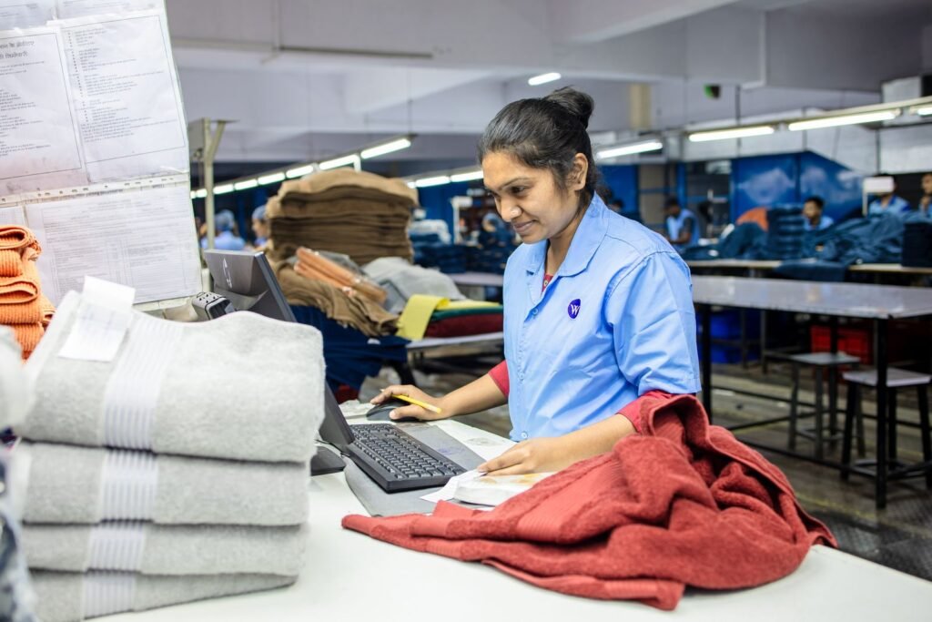 Factory worker inspecting materials for quality control