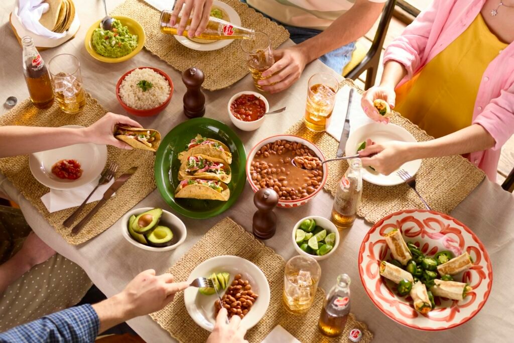 Multigenerational family gathered around a table enjoying a feast together
