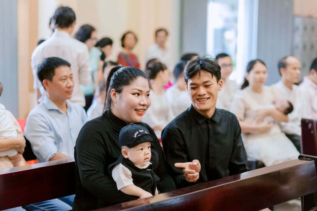 A family enjoys time together in a church setting, filled with warmth and happiness