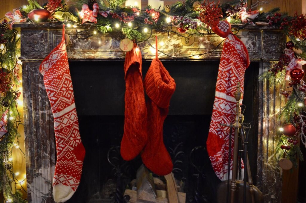 Festively decorated fireplace with Christmas stockings hanging