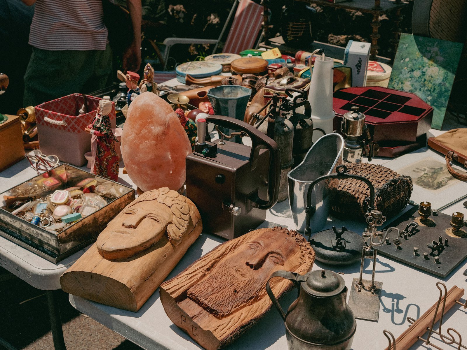 Table full of various vintage items at a flea market
