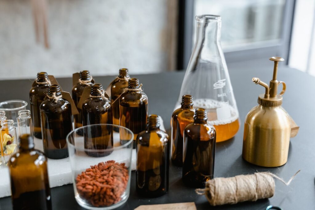 A variety of glass bottles with essential oils and herbs
