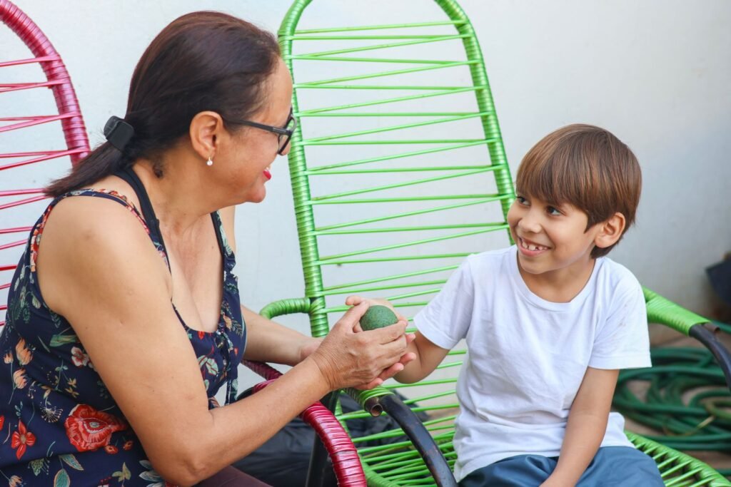 A grandmother and grandson enjoying a heartfelt moment together outdoors