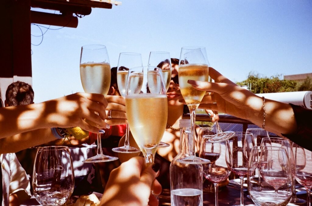 Group of people toasting with wine glasses at a celebration