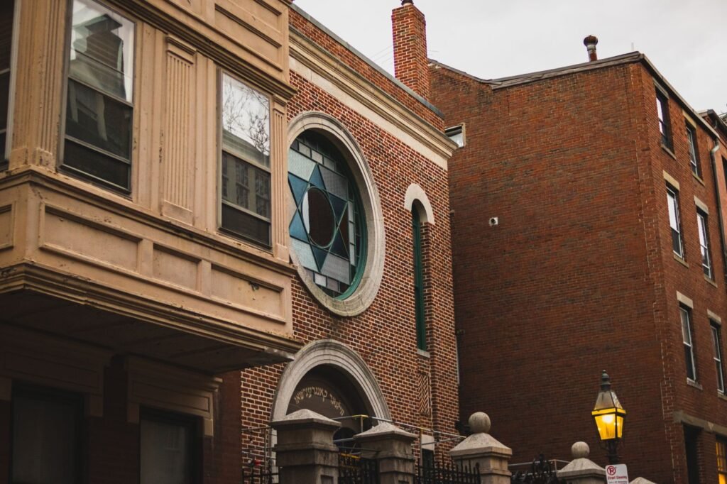 Photo of a historic synagogue with a Star of David stained glass window