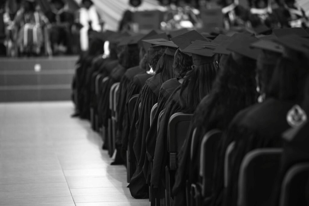Large group of people in graduation gowns at a ceremony
