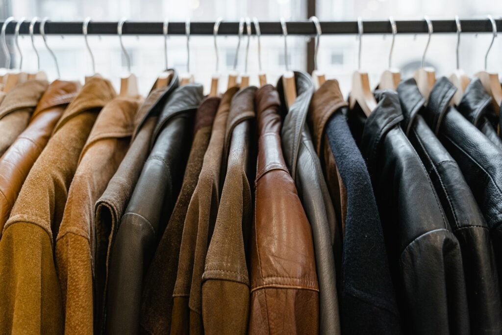 Close-up view of leather jackets hanging neatly on a rack