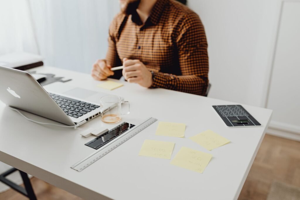 Modern workspace setup with laptop and office supplies