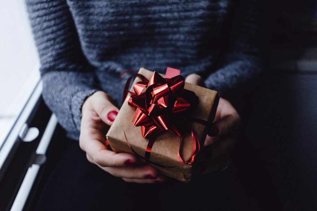 Person holding a wrapped present box