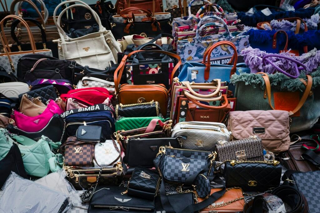 Pile of vintage purses and handbags sitting next to each other
