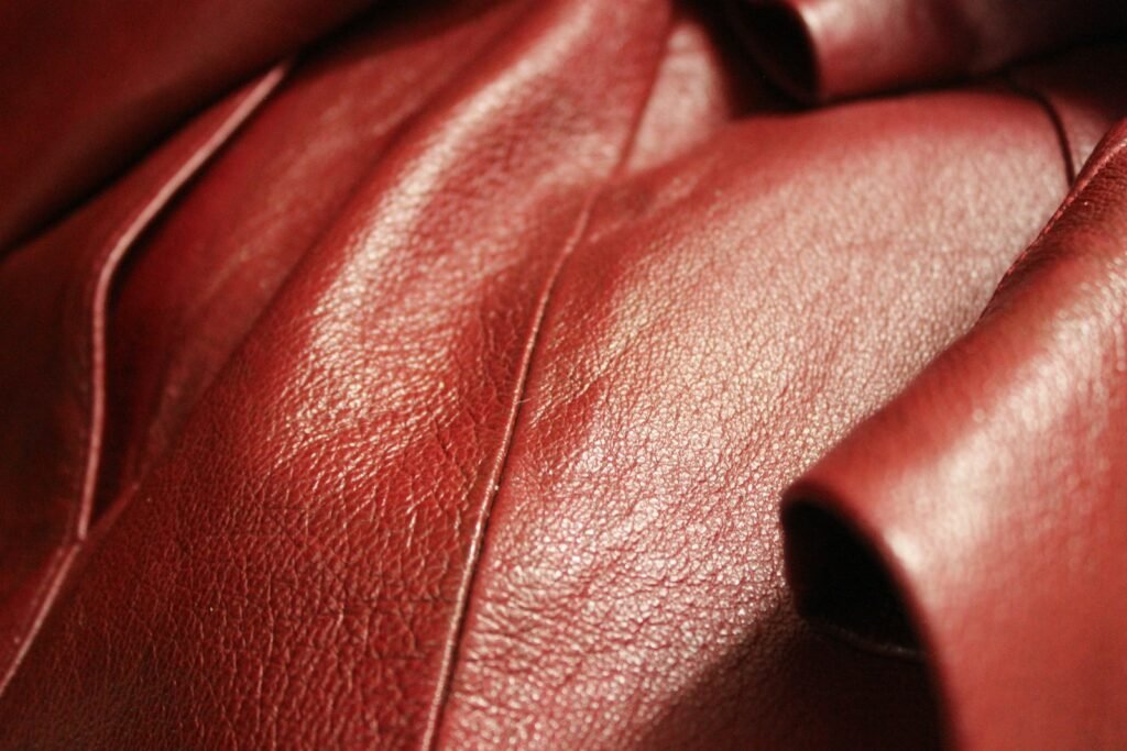 Close-up of rich red leather material similar in tone to oxblood leather