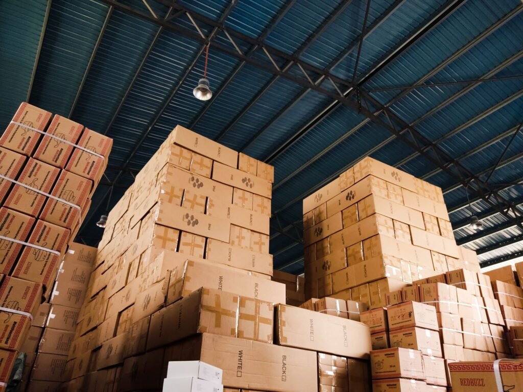 High stacks of cardboard boxes organized in a warehouse