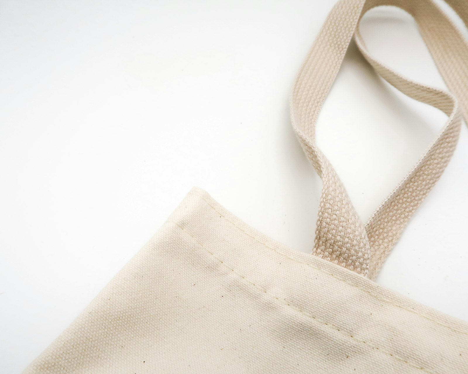 Structured leather tote bag with a clean, deconstructed silhouette