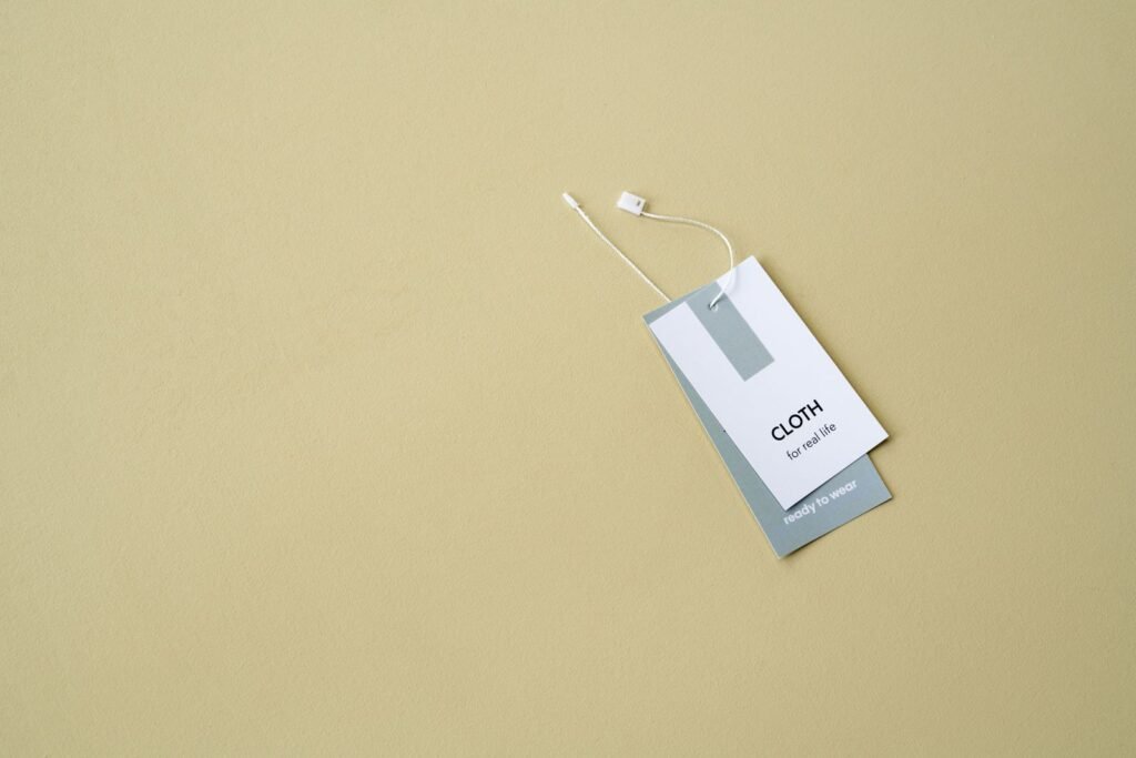A stylish clothing label displayed on a muted background