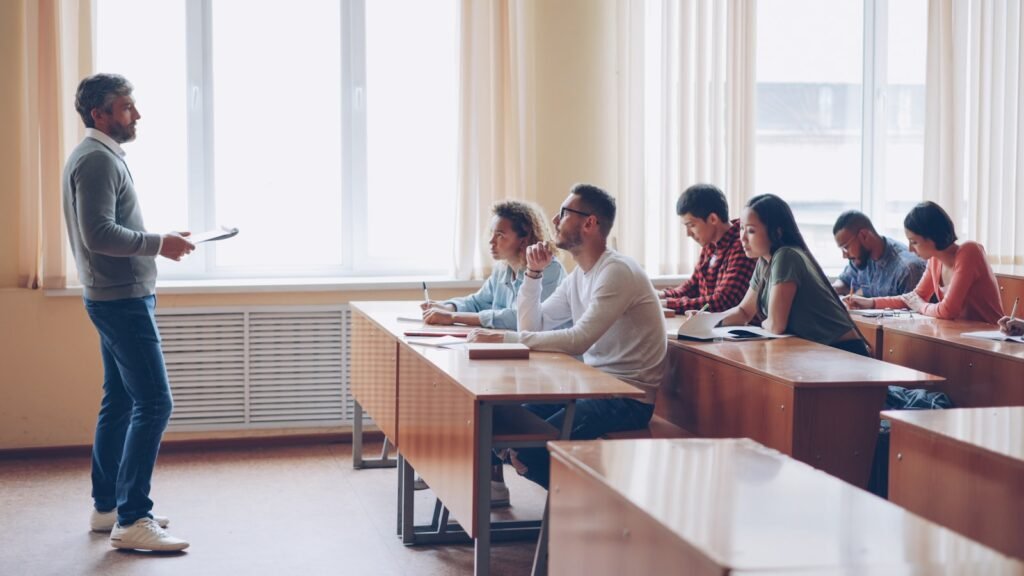 Teacher instructing students during a classroom lecture