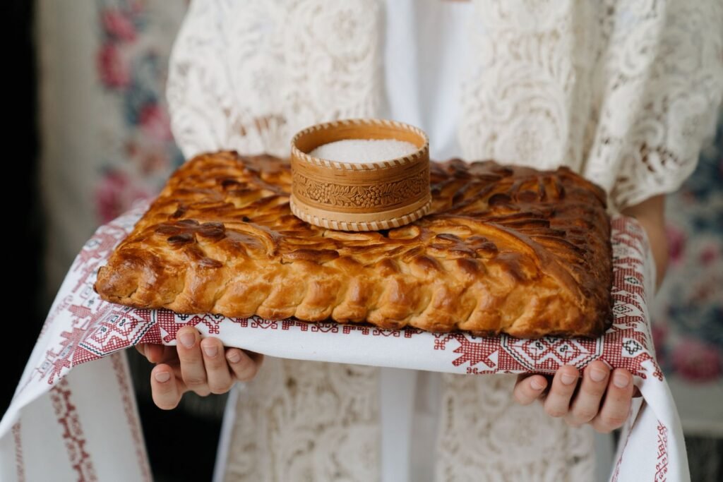 A close-up of traditional bread and salt, symbolizing hospitality and culture