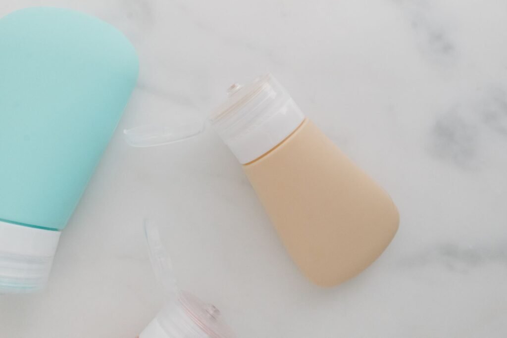 Soft-colored squeezable travel bottles with flip-top caps