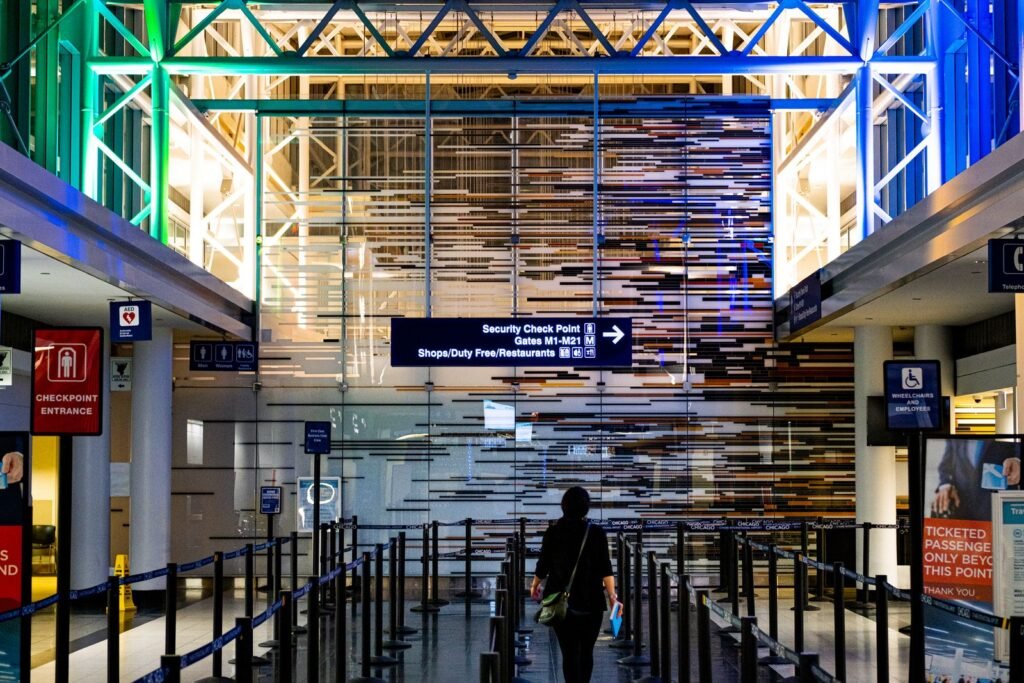 A traveler enters the security checkpoint at an airport