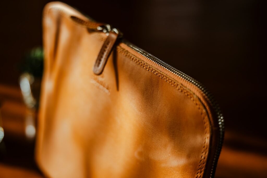 Close-up texture of vegetable-tanned leather used in quality Dopp kits