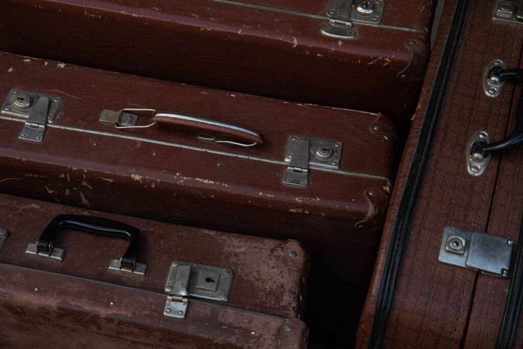 Stack of vintage leather suitcases from the golden age of travel
