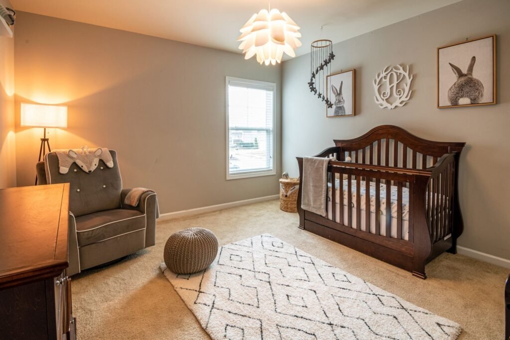 Warm and inviting baby room with an elegant crib and armchair