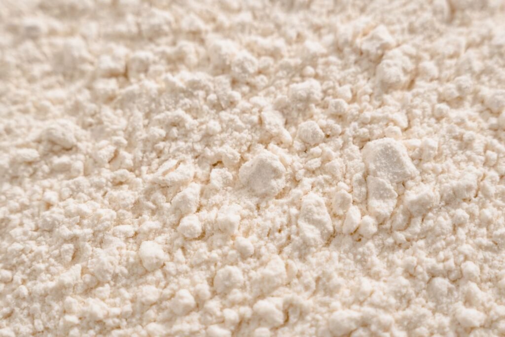 Close-up of white absorbent powder, such as cornstarch, used to lift oil stains