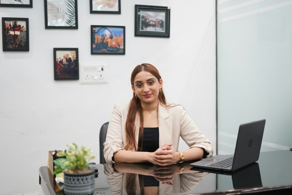Woman sitting at a desk working on a laptop